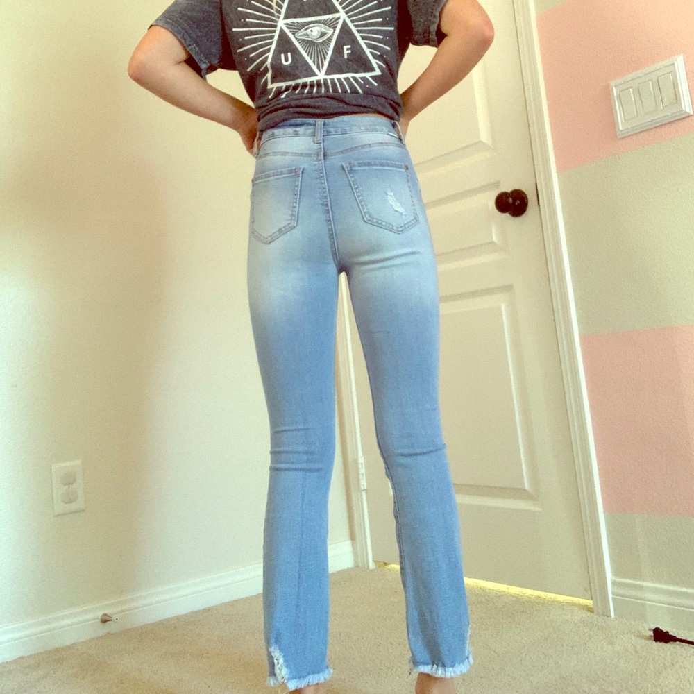 Light ripped blue jeans